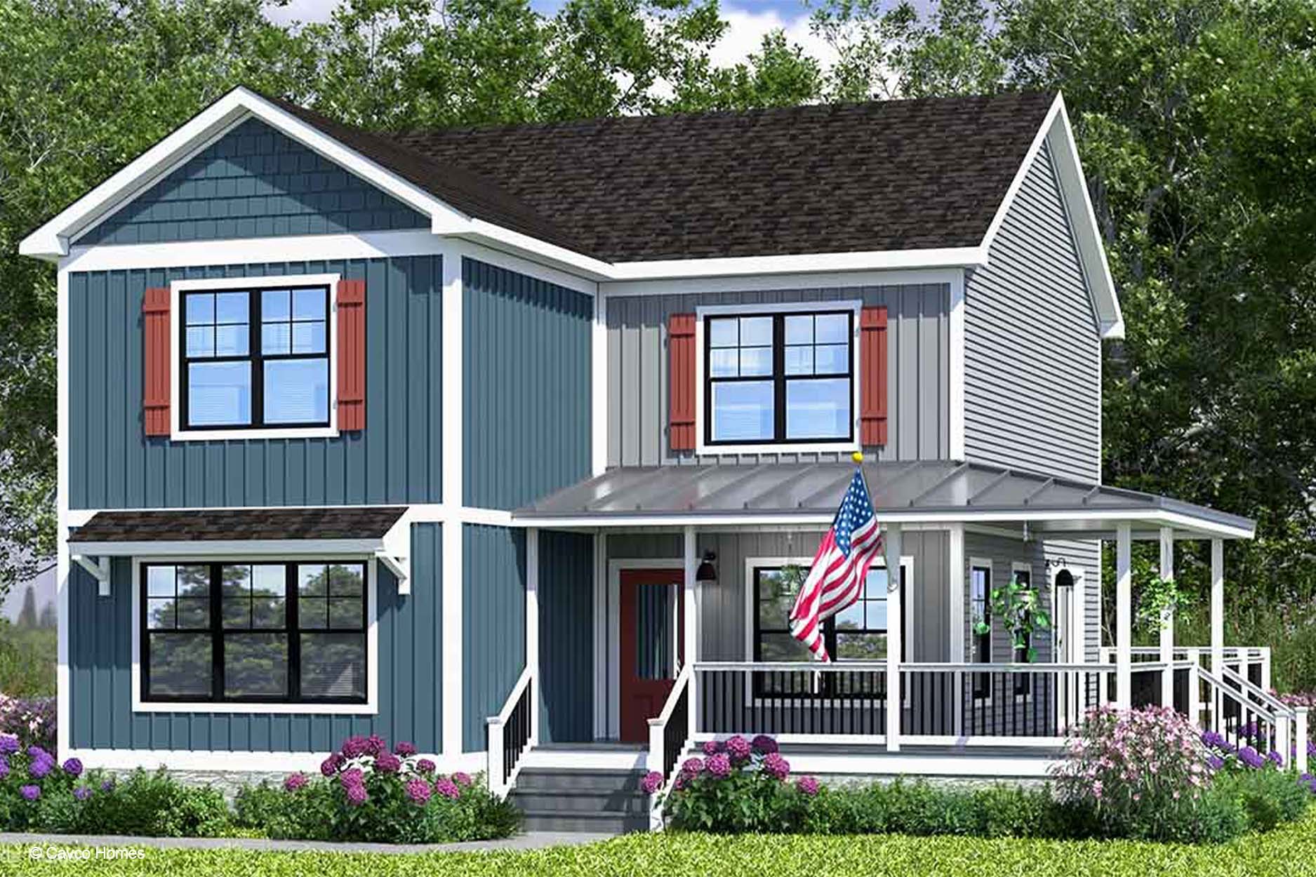 Two-story blue modular home with red shutters, front porch, American flag, and a garden filled with pink flowers.